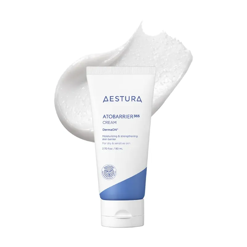 White AESTURA ATOBARRIER365 Cream tube (Korean-market DermaON label) standing in front of a swirl of white cream on a white background.