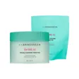 A mint-green BRING GREEN jar with a teal lid, its matching refill pouch standing behind it, on white