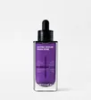 A square purple glass dropper bottle with a black dropper and white MEDIHEAL lettering, on a light grey background