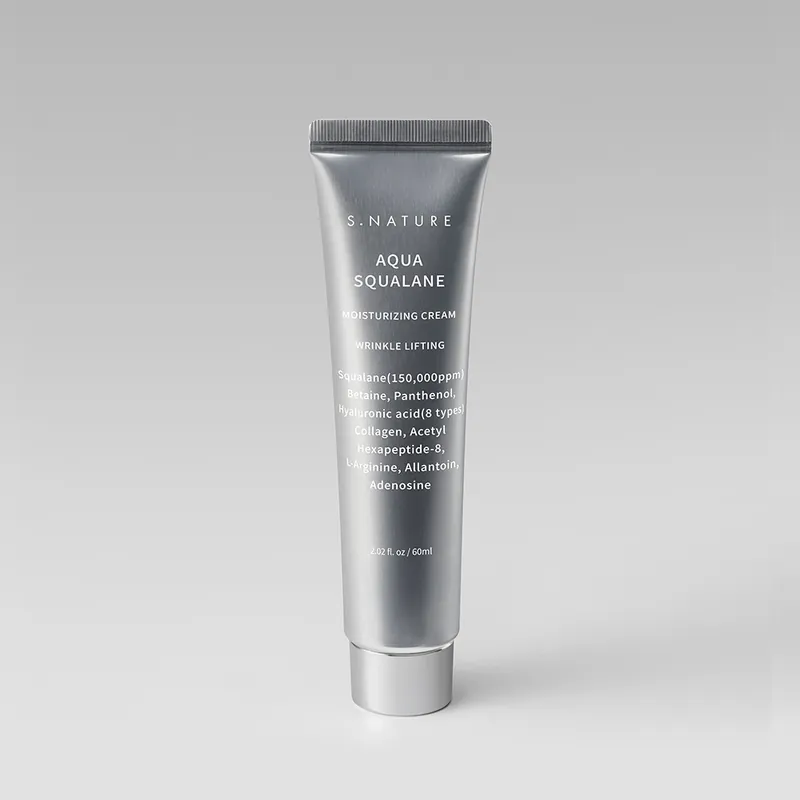 Upright silver squeeze tube of S.NATURE Aqua Squalane Moisturizing Cream, 60 ml, standing on its cap against a plain light-grey background.